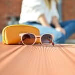 sunglasses beside a purse